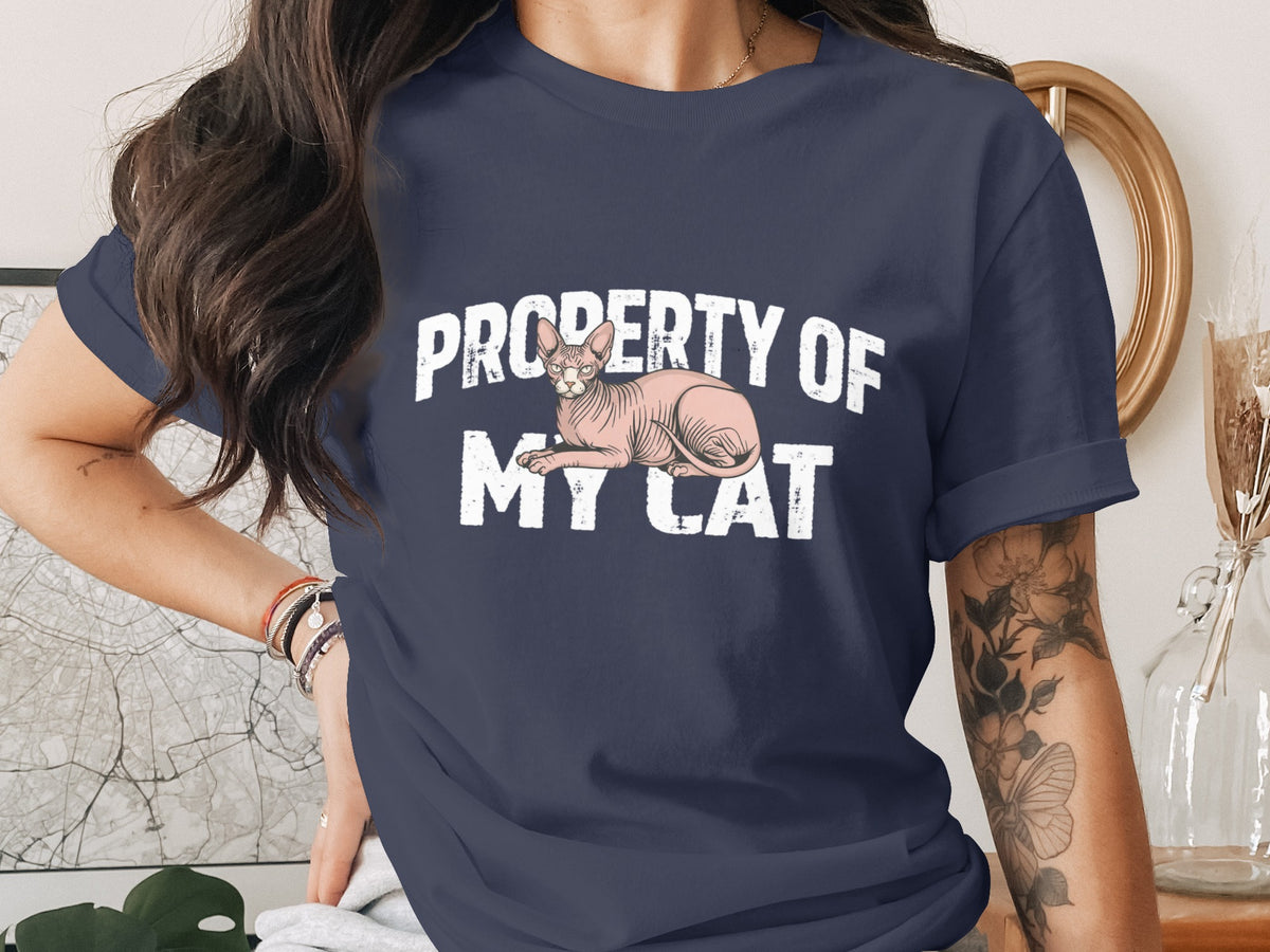 Dark blue t-shirt with a pink Sphynx cat and text "PROPERTY OF MY CAT".
