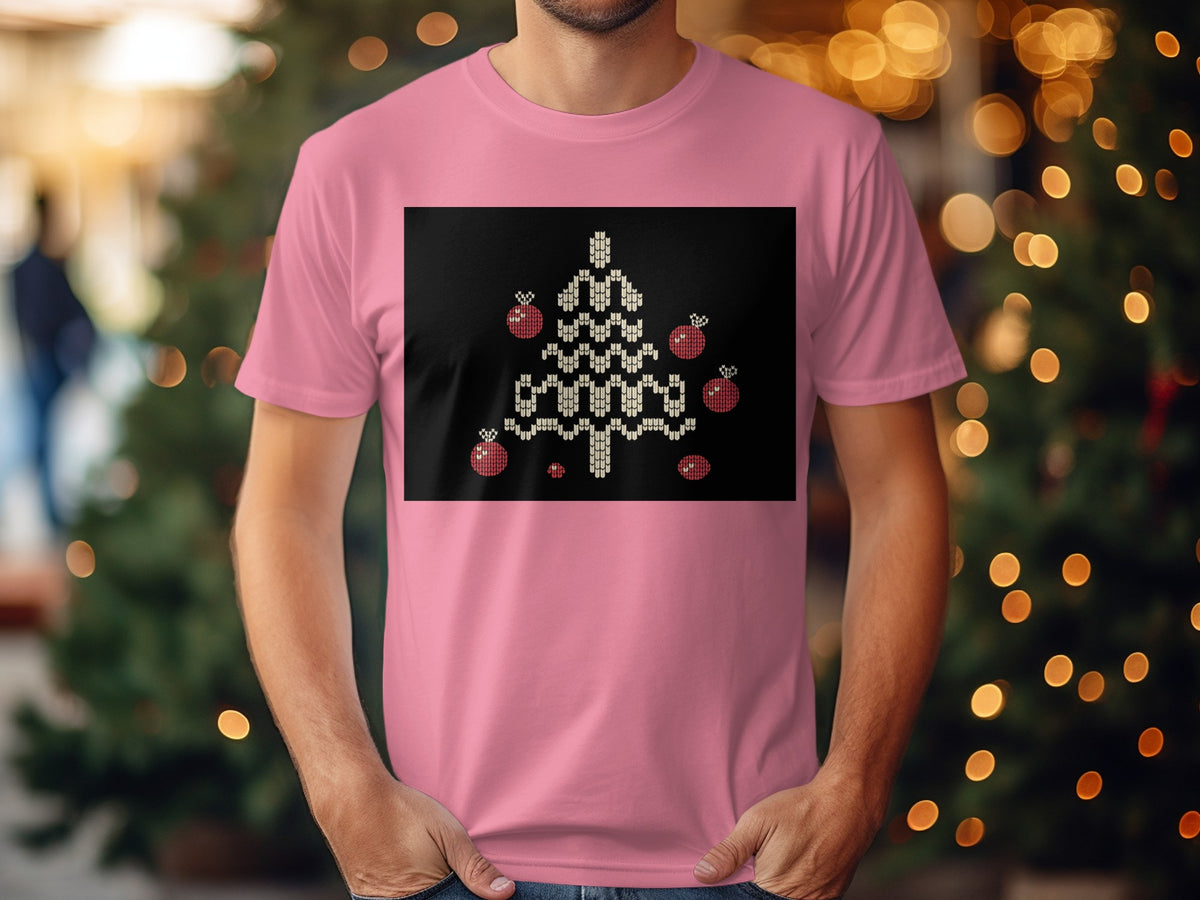 Pink t-shirt with a black rectangular graphic of a knitted Christmas tree with ornaments.
