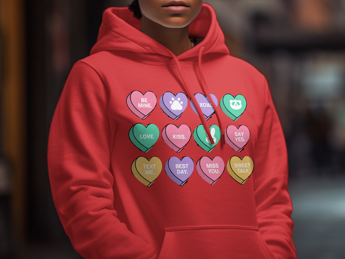 Red hoodie with Valentine's Day candy hearts graphic featuring text and icons.
