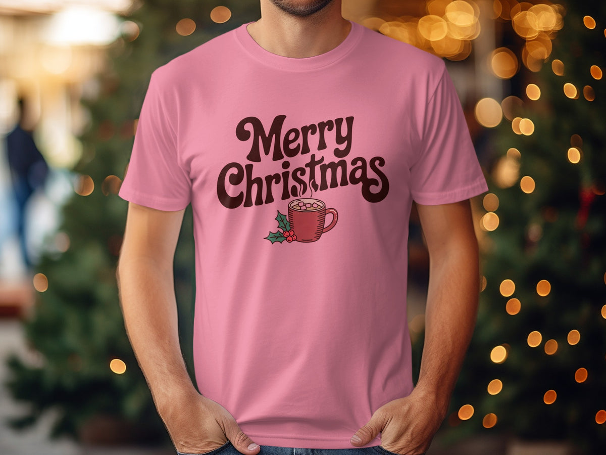 Pink t-shirt with "Merry Christmas" text and a hot cocoa mug with holly.