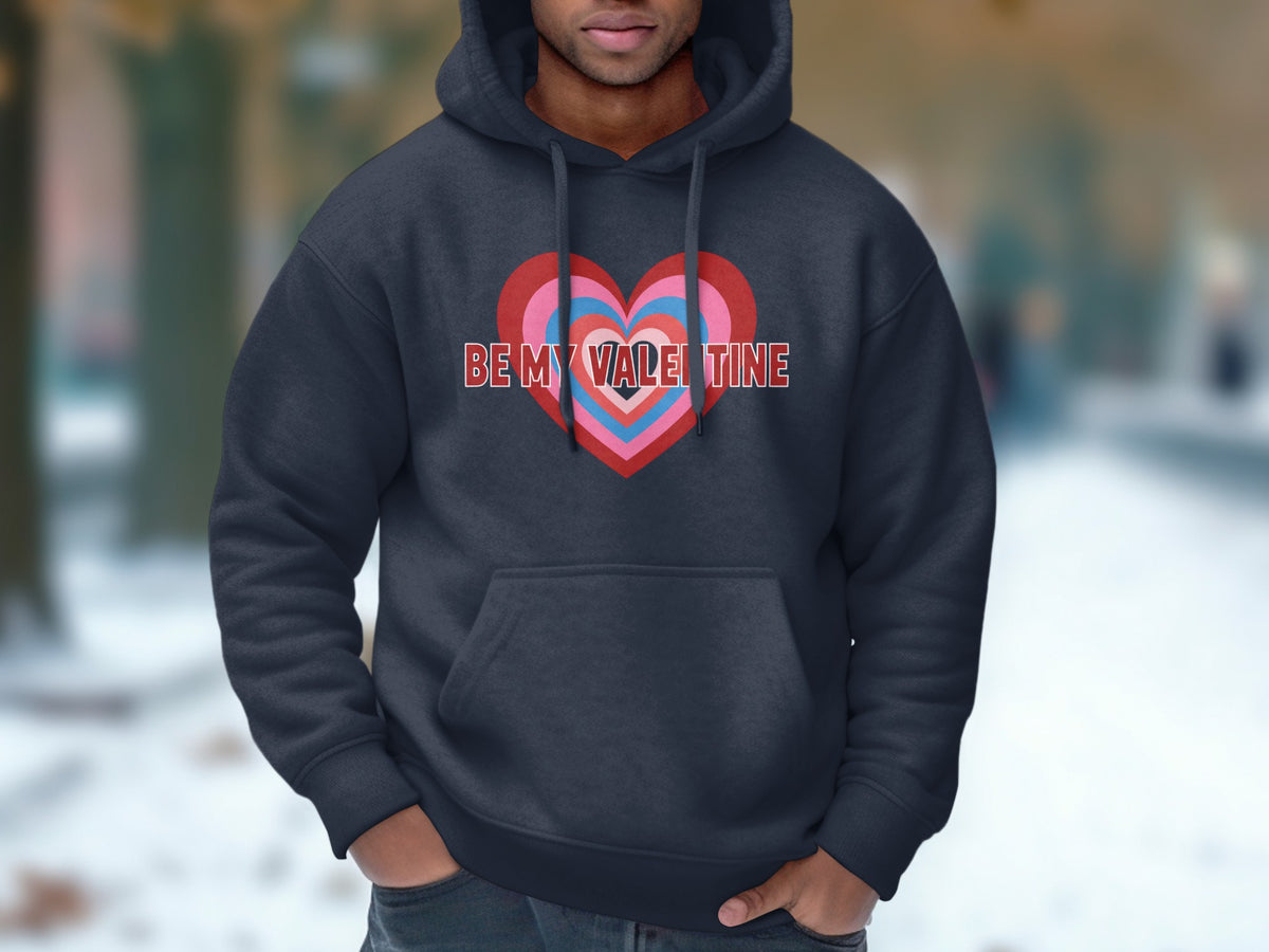 Dark grey hoodie with a concentric heart graphic and "BE MY VALENTINE" text.