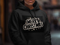 Black hoodie with "Merry Christmas" text and snowflakes.