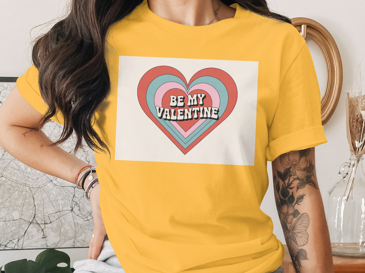Yellow t-shirt with a retro "Be My Valentine" heart graphic.
