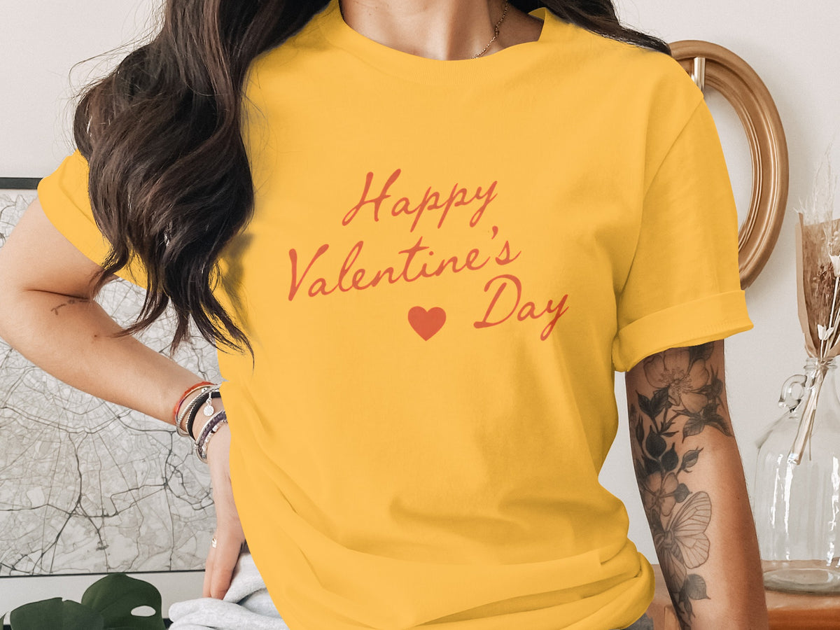 Yellow t-shirt with red script text "Happy Valentine's Day" and a heart.