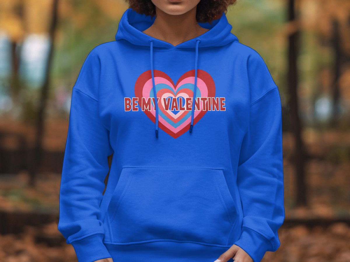 Blue hoodie with layered heart graphic and "BE MY VALENTINE" text.