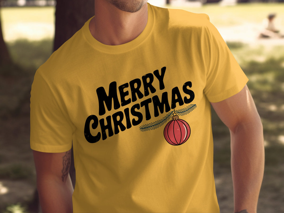 Yellow t-shirt with black "Merry Christmas" text and a red ornament.