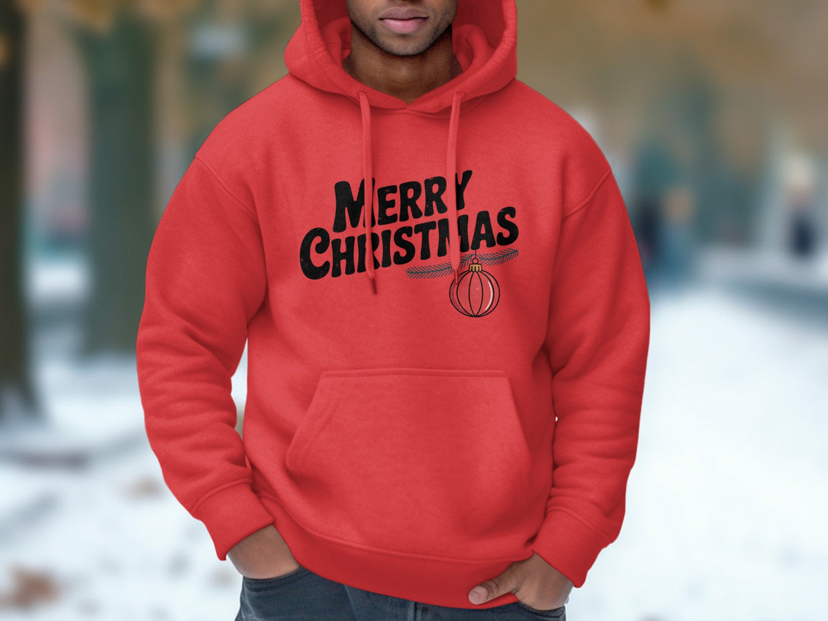 A man wearing a red hooded sweatshirt with black text reading "Merry Christmas" and an ornament graphic.