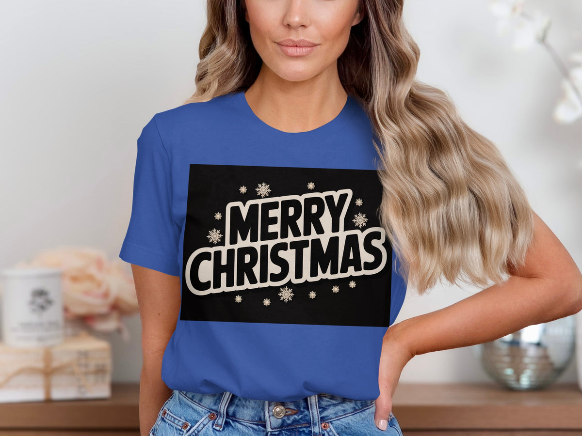 Blue t-shirt with a black rectangle featuring "MERRY CHRISTMAS" and snowflakes.