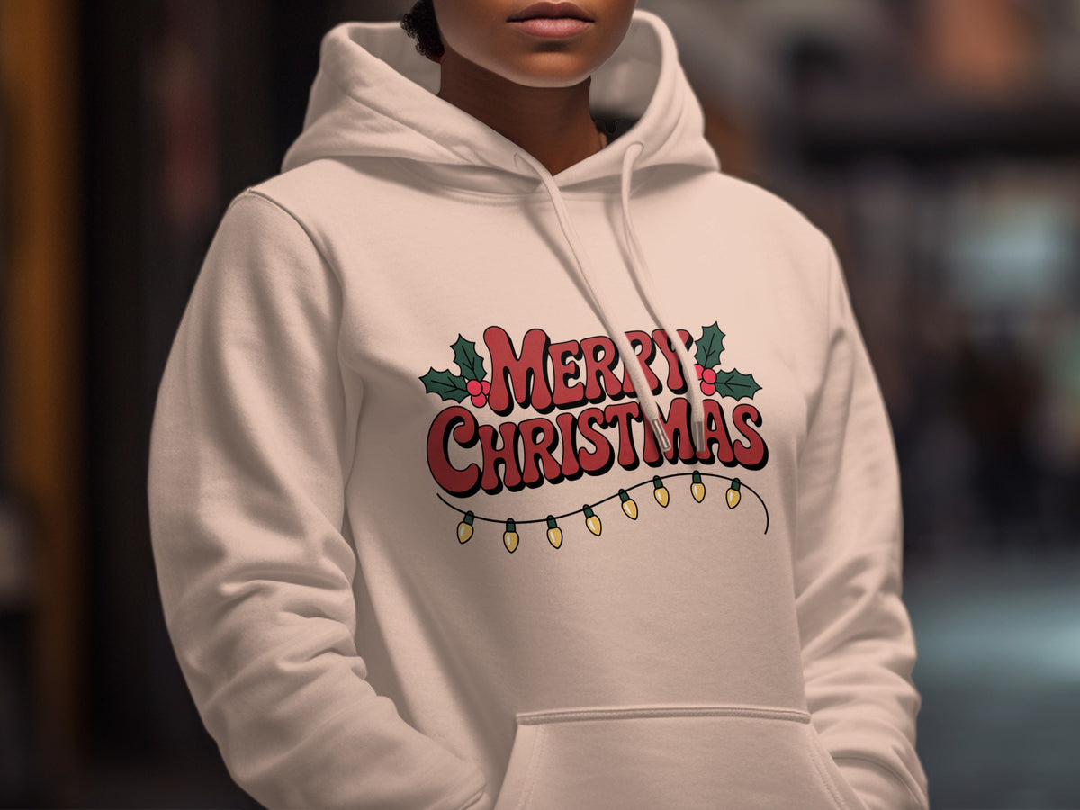 A person wearing a white hooded sweatshirt with red Merry Christmas text and holiday lights.