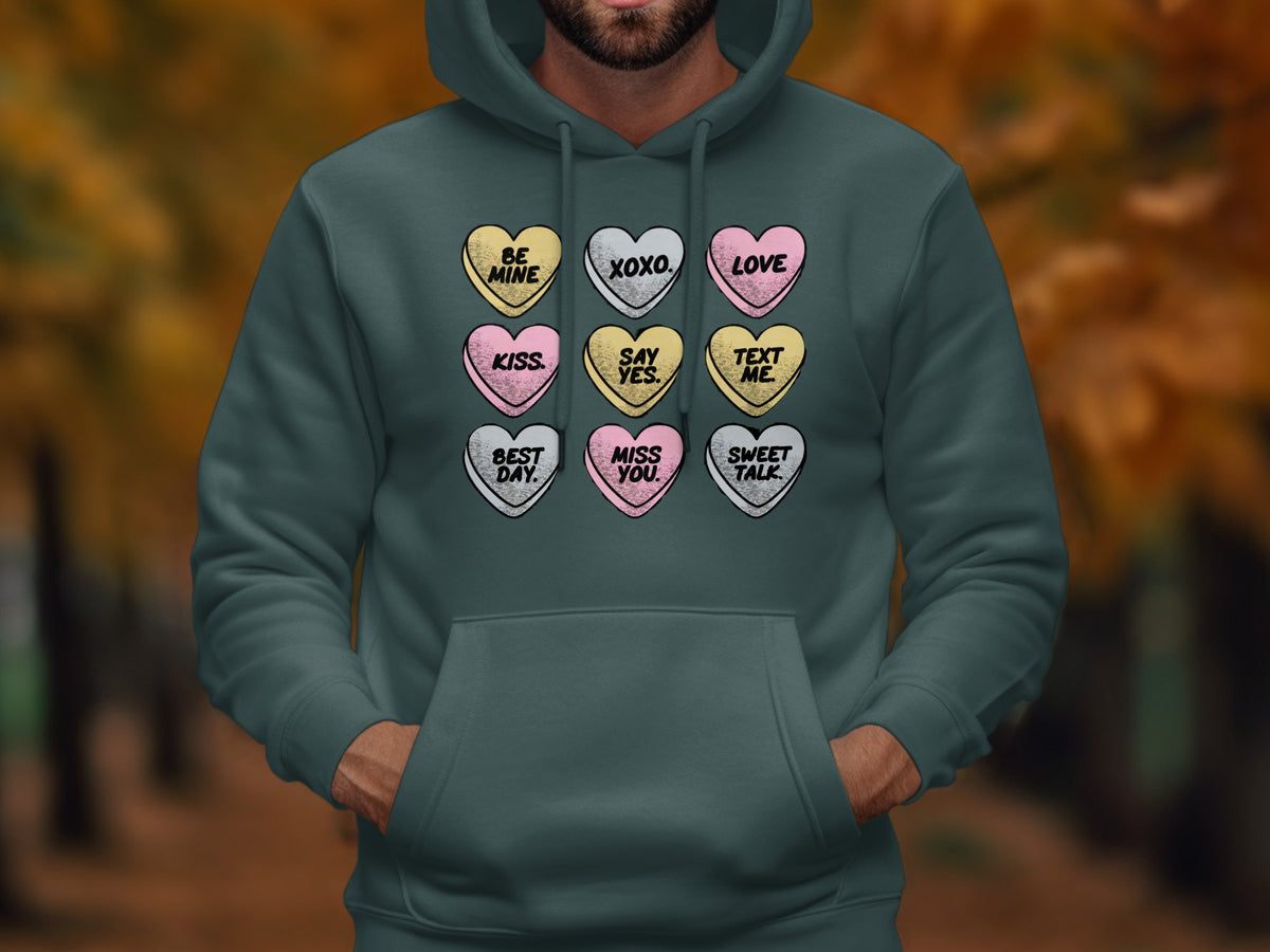 Hoodie with a graphic of nine conversation hearts: Be Mine, XOXO, Love, Kiss, Say Yes, Text Me, Best Day, Miss You, Sweet Talk.