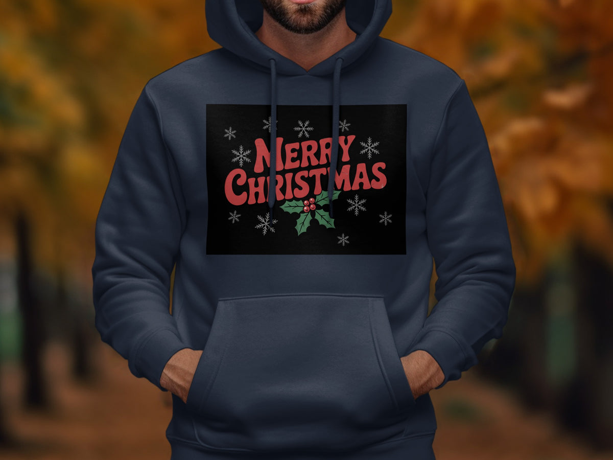 A person wearing a dark blue hooded sweatshirt featuring a Merry Christmas graphic with snowflakes and holly.