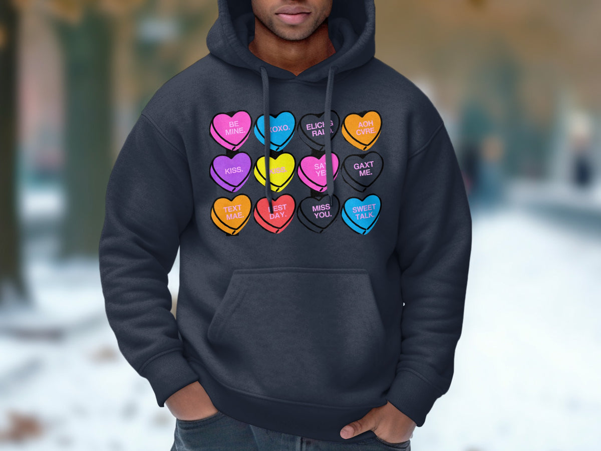 Dark grey hoodie with a collage of colorful candy hearts with text.