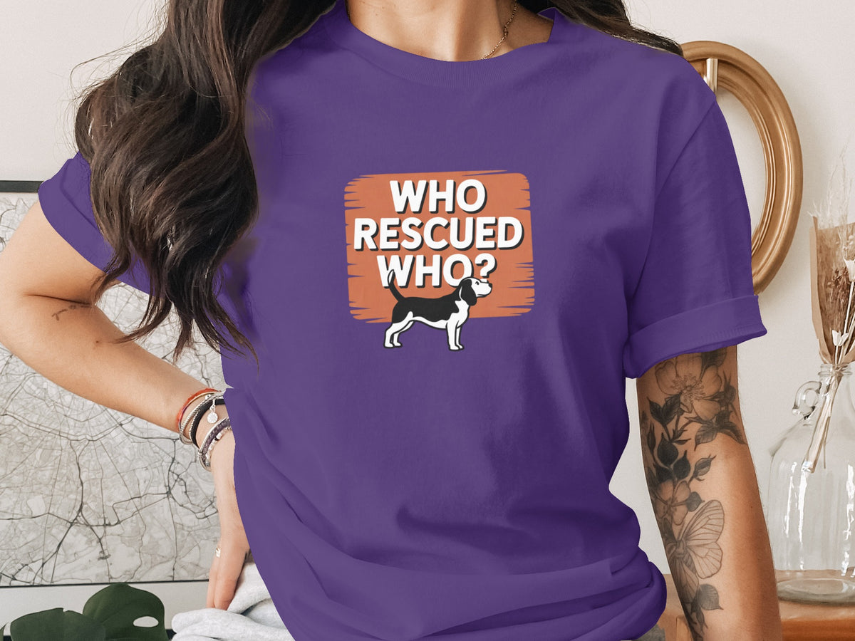 Purple t-shirt with black and white dog and "Who Rescued Who?" text.