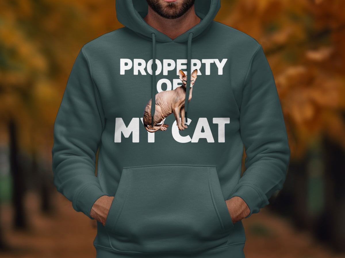 Dark green hoodie with white text "PROPERTY OF MY CAT" and a Sphynx cat.