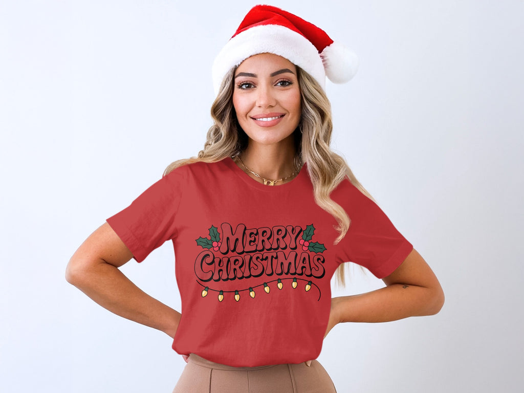 Woman in Santa hat and red shirt with "Merry Christmas" and lights graphic.