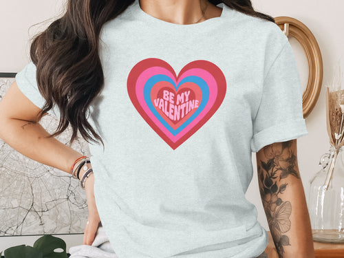 Light gray t-shirt with nested hearts graphic and "BE MY VALENTINE" text.