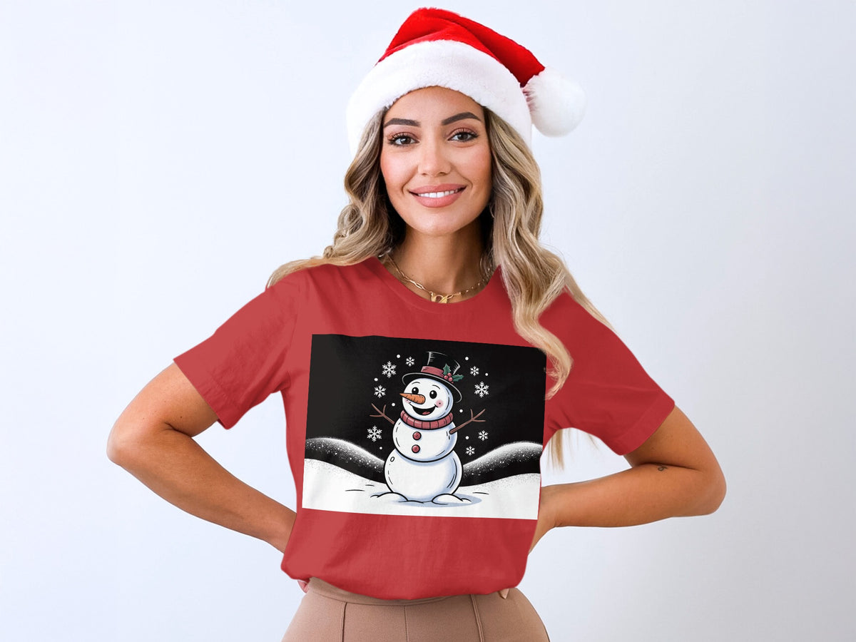 Woman in red t-shirt with a cartoon snowman and snowflakes graphic.