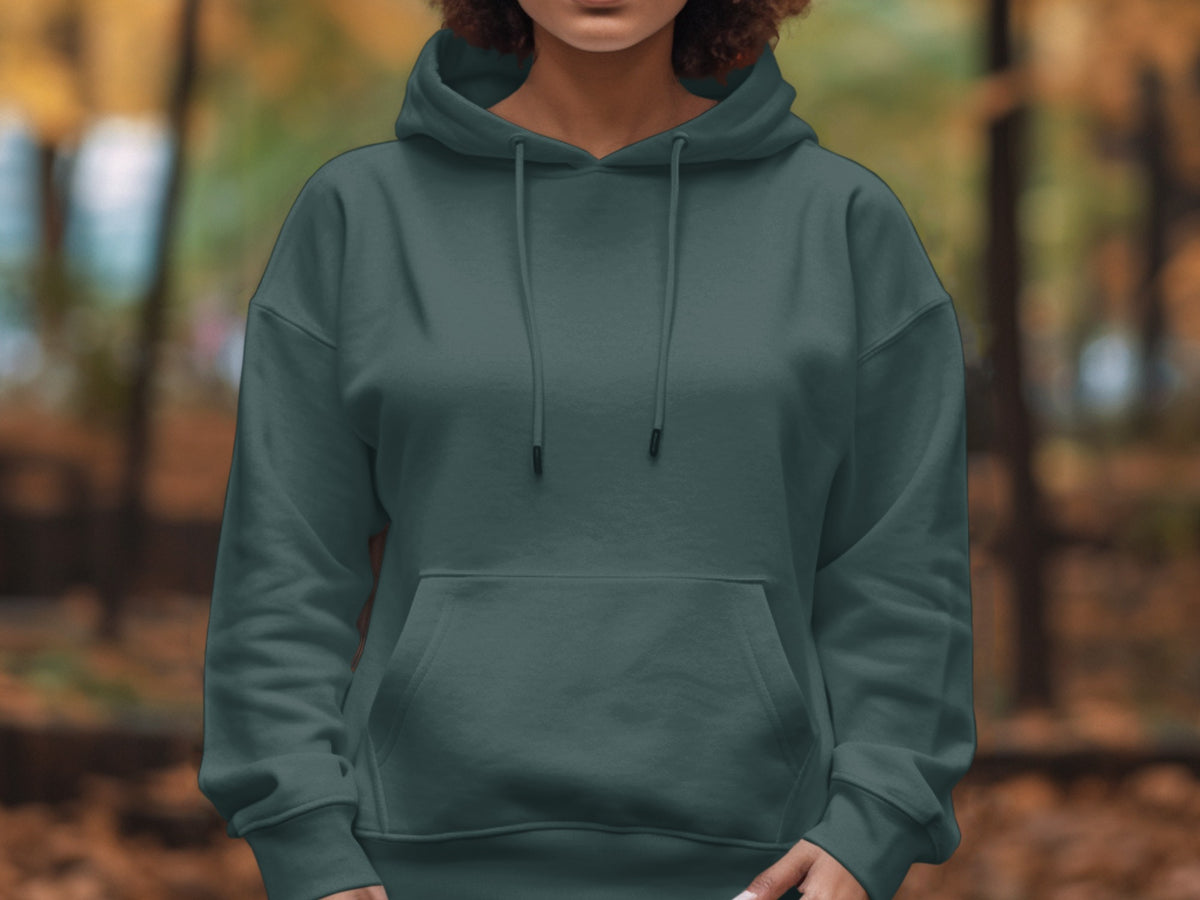 Person wearing a dark teal hooded sweatshirt with a front pocket.