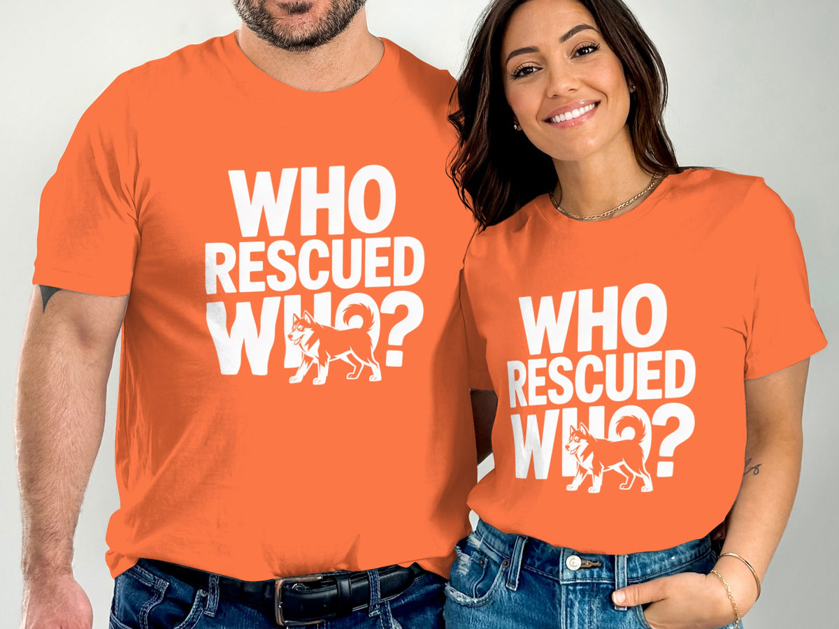 Orange t-shirts with white "WHO RESCUED WHO?" text and a dog graphic.