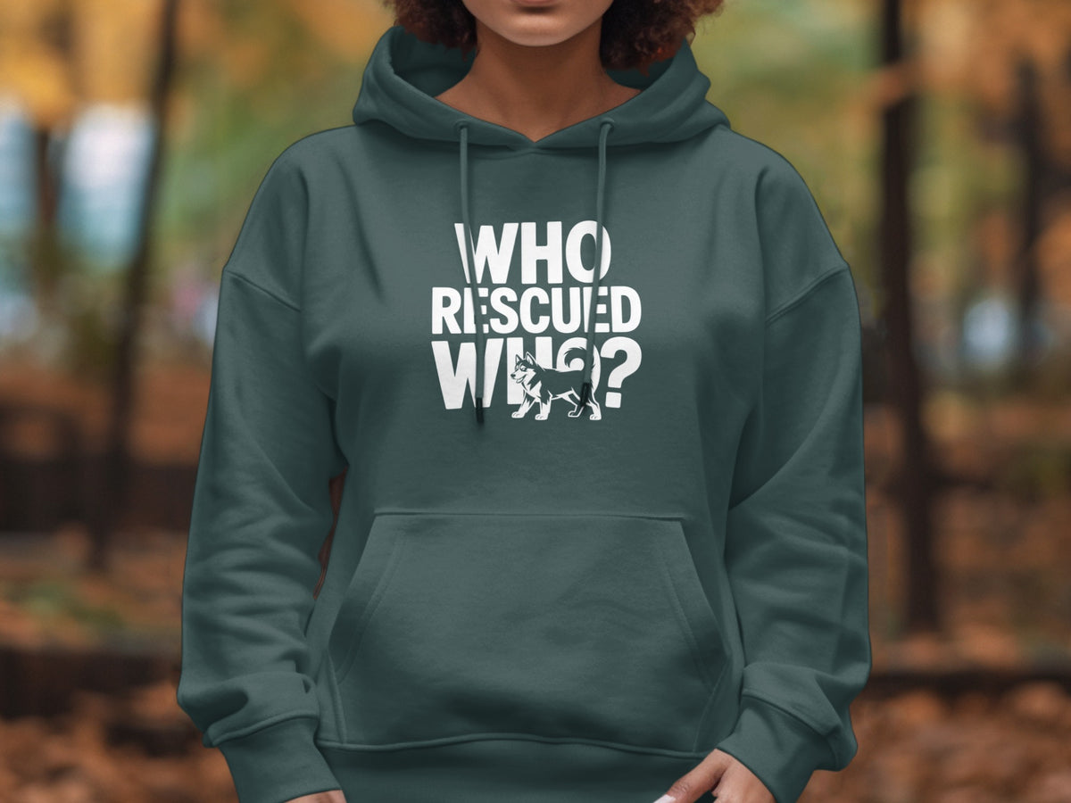Dark green hoodie with white text "WHO RESCUED WHO?" and a husky dog illustration.