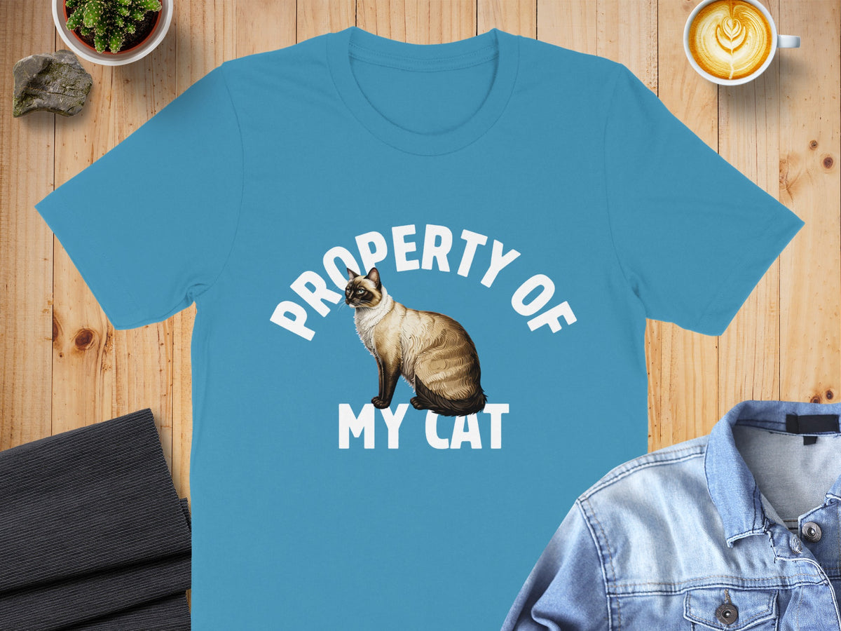 Blue t-shirt with text "PROPERTY OF MY CAT" and Siamese cat illustration.