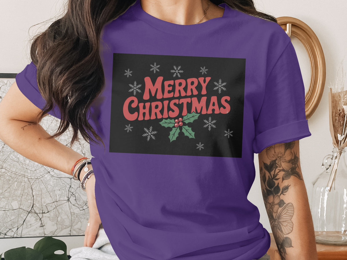 Purple t-shirt with "Merry Christmas" text and holly design.