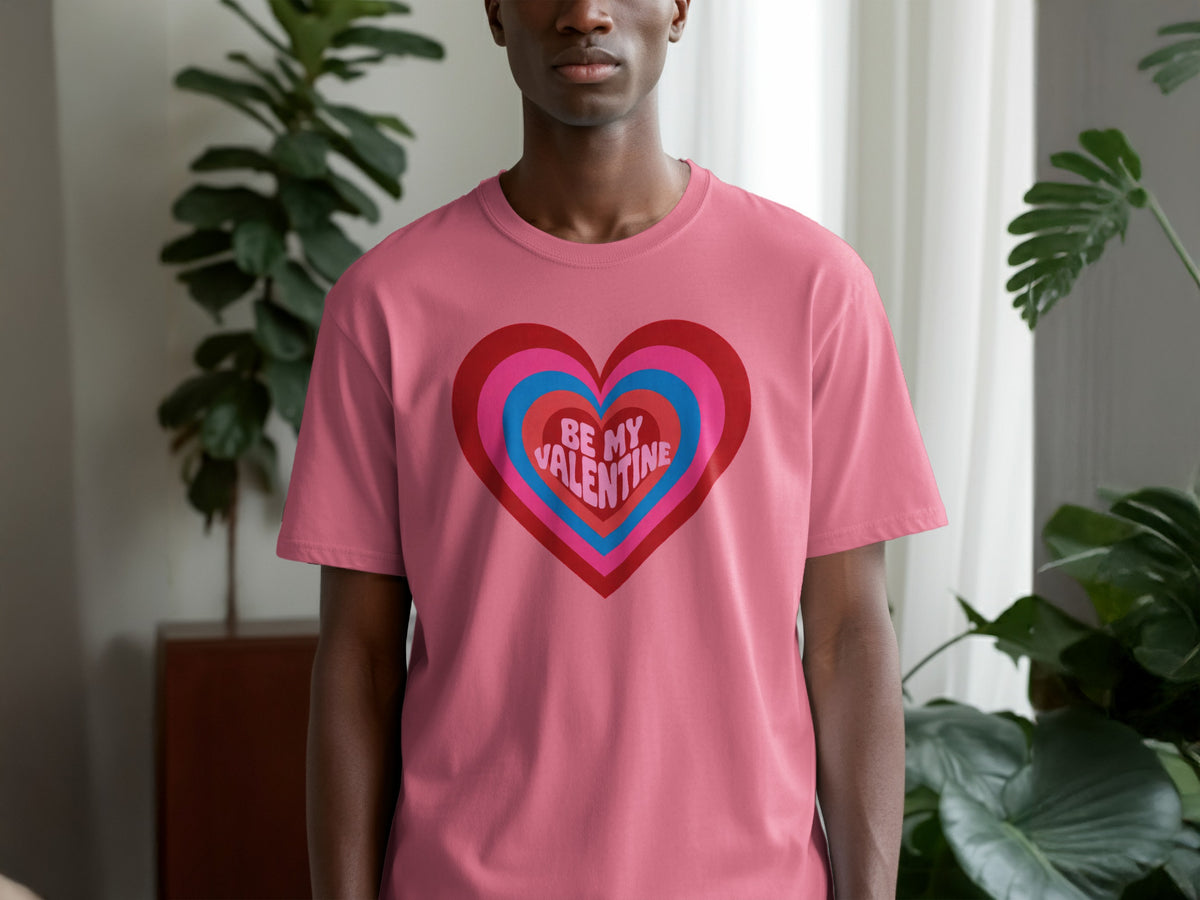 Pink t-shirt with layered heart graphic and text "BE MY VALENTINE".