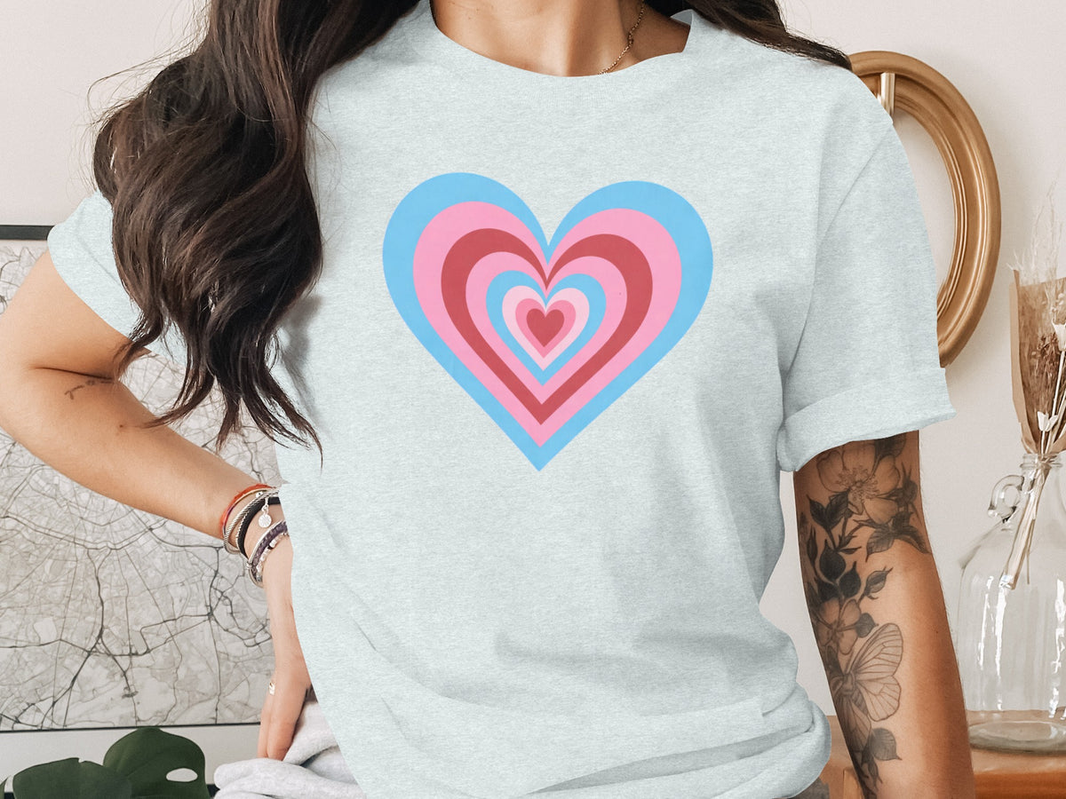 Light blue t-shirt with nested pink and blue hearts graphic.
