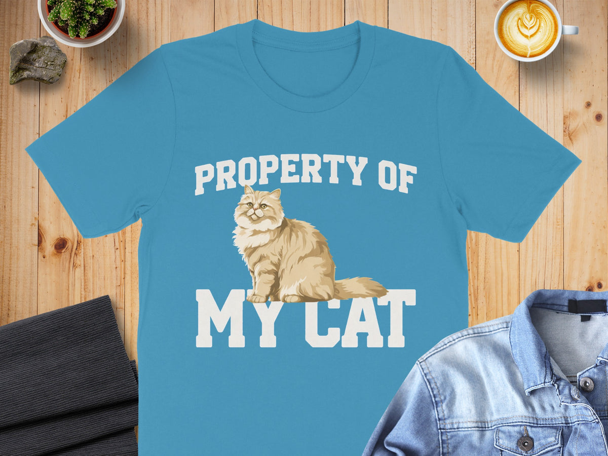 Blue t-shirt with "PROPERTY OF MY CAT" text and a fluffy cat illustration.