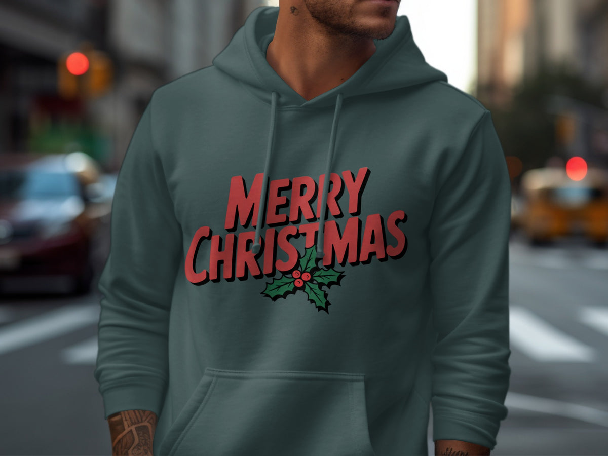 Dark green hoodie on a person with "MERRY CHRISTMAS" and holly graphic.