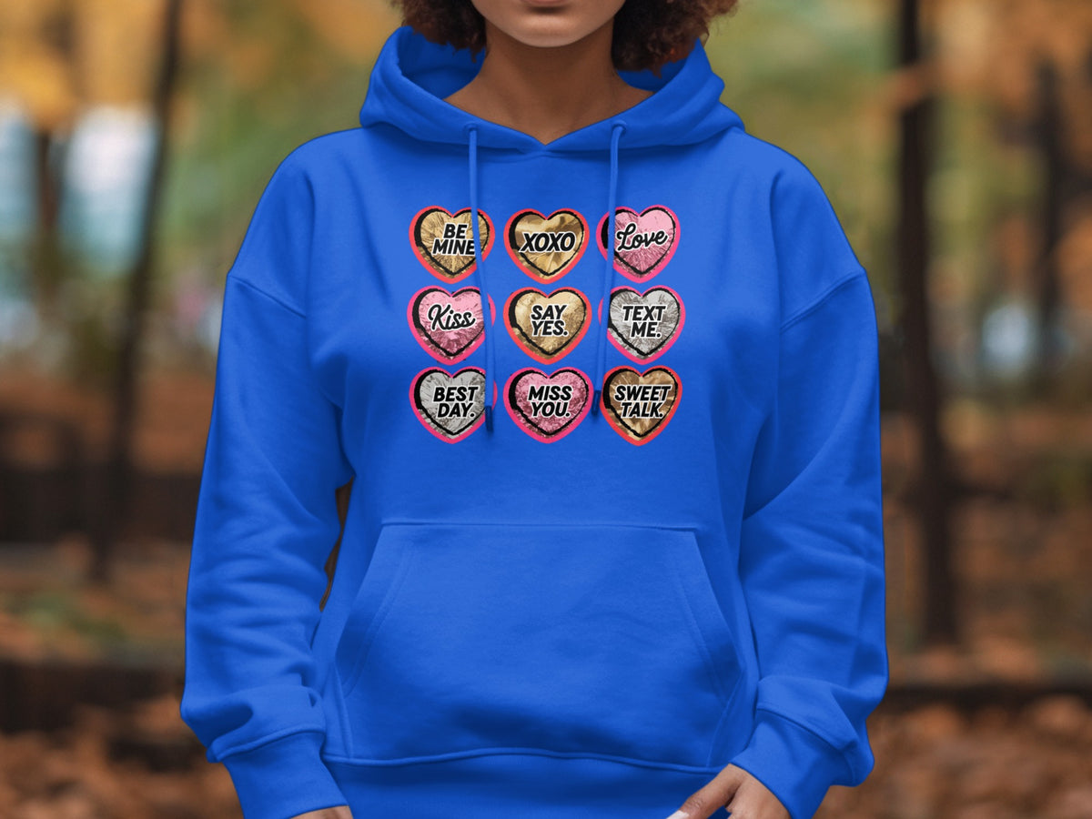 Blue hoodie with 9 heart-shaped candy graphics, each with text.
