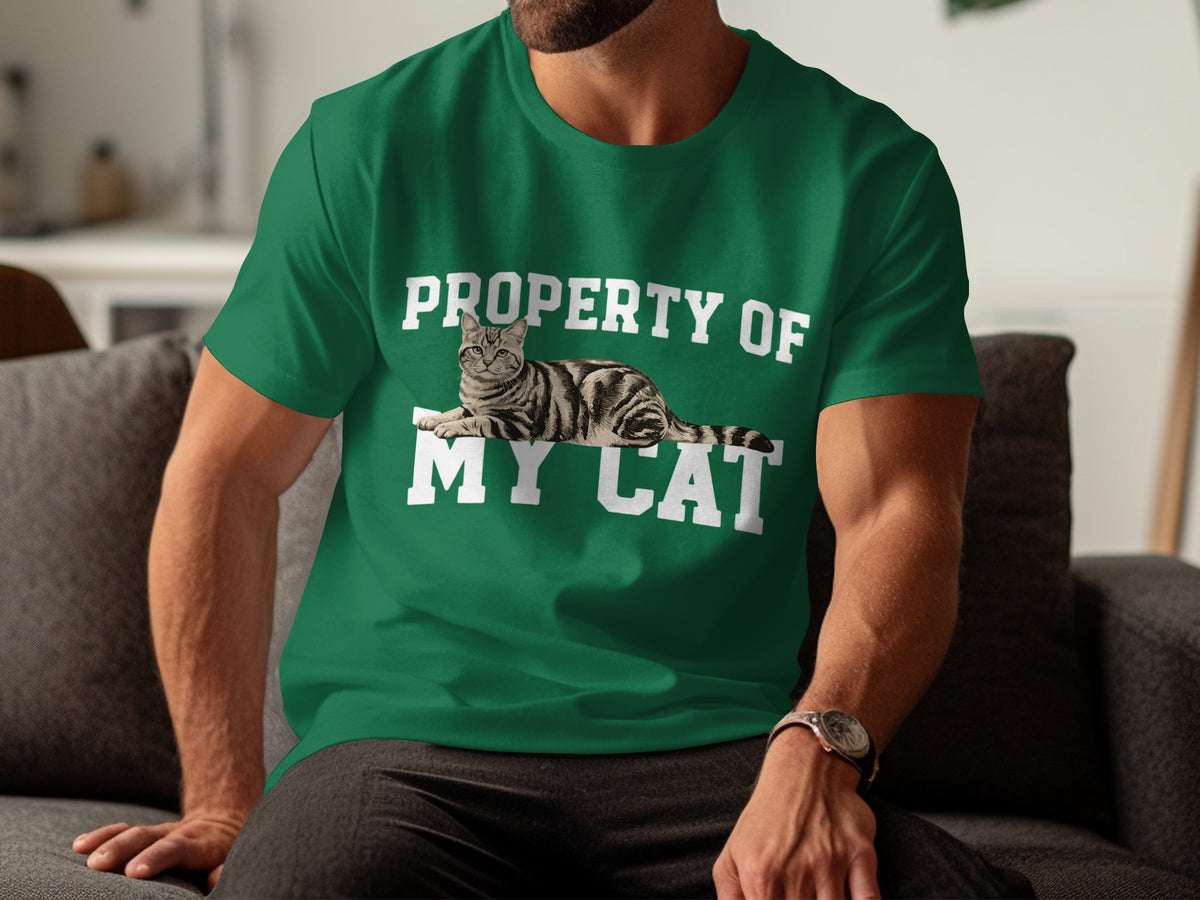 Green t-shirt with "PROPERTY OF MY CAT" and a tabby cat graphic.