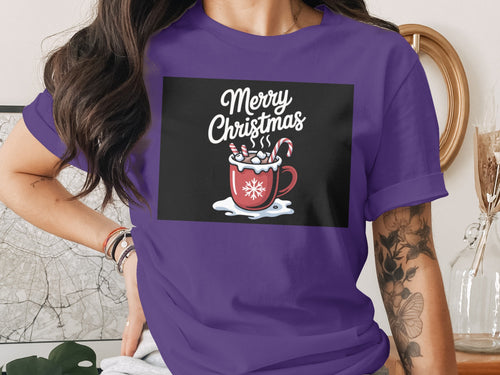 Purple t-shirt with "Merry Christmas" graphic of a mug of hot chocolate.