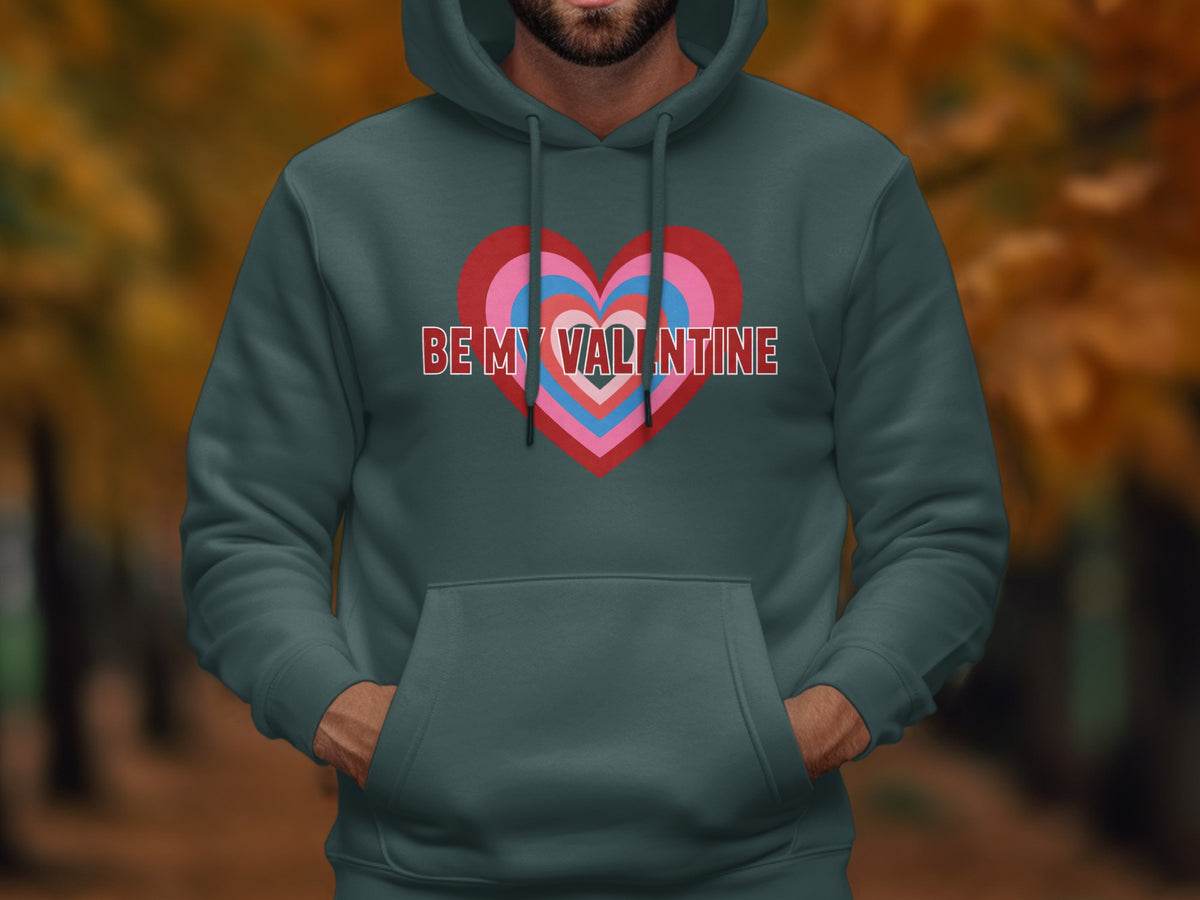 Teal hoodie with concentric hearts and "BE MY VALENTINE" text.