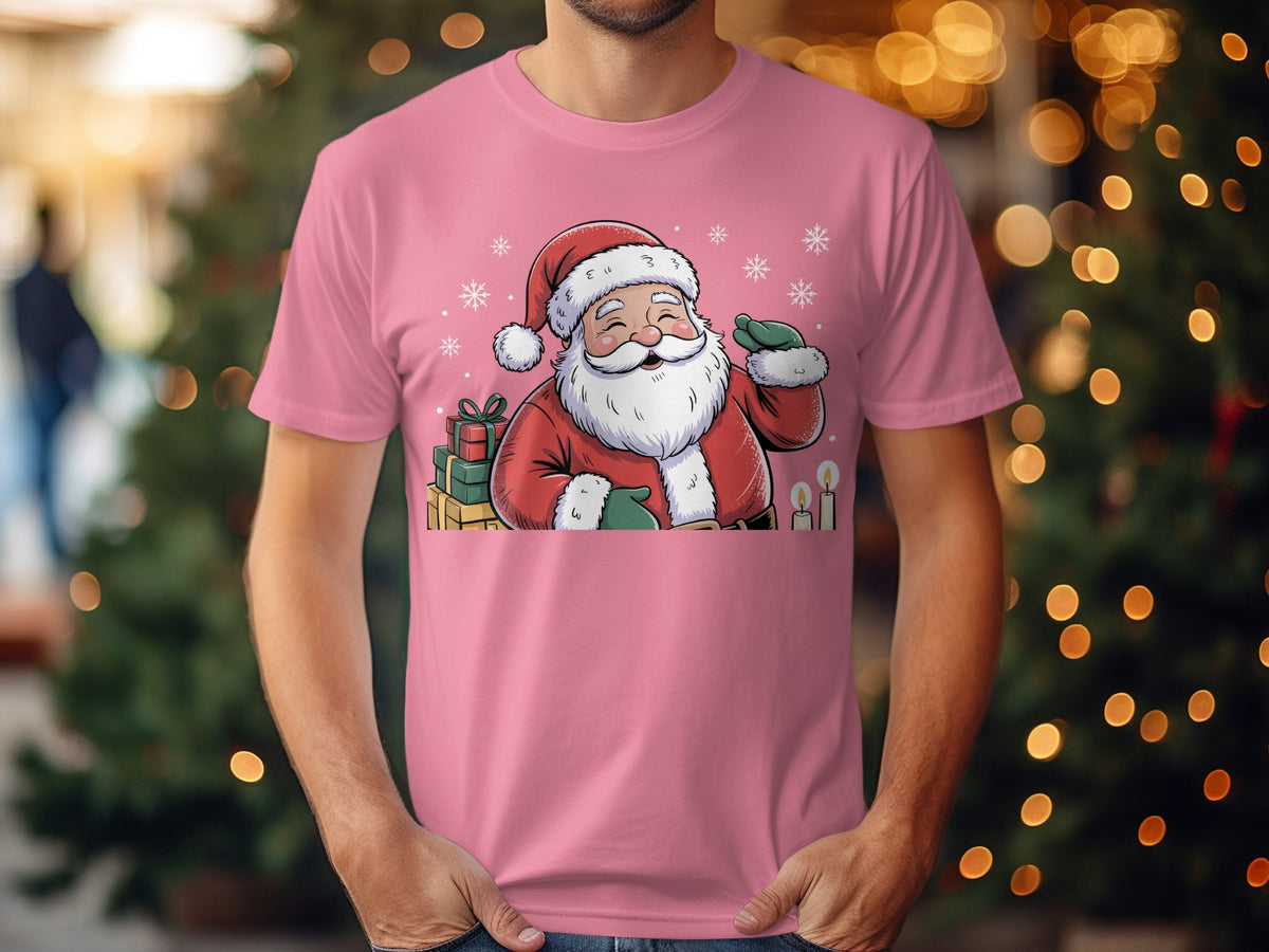 Pink t-shirt with a cartoon Santa Claus, gifts, snowflakes, and candles graphic.