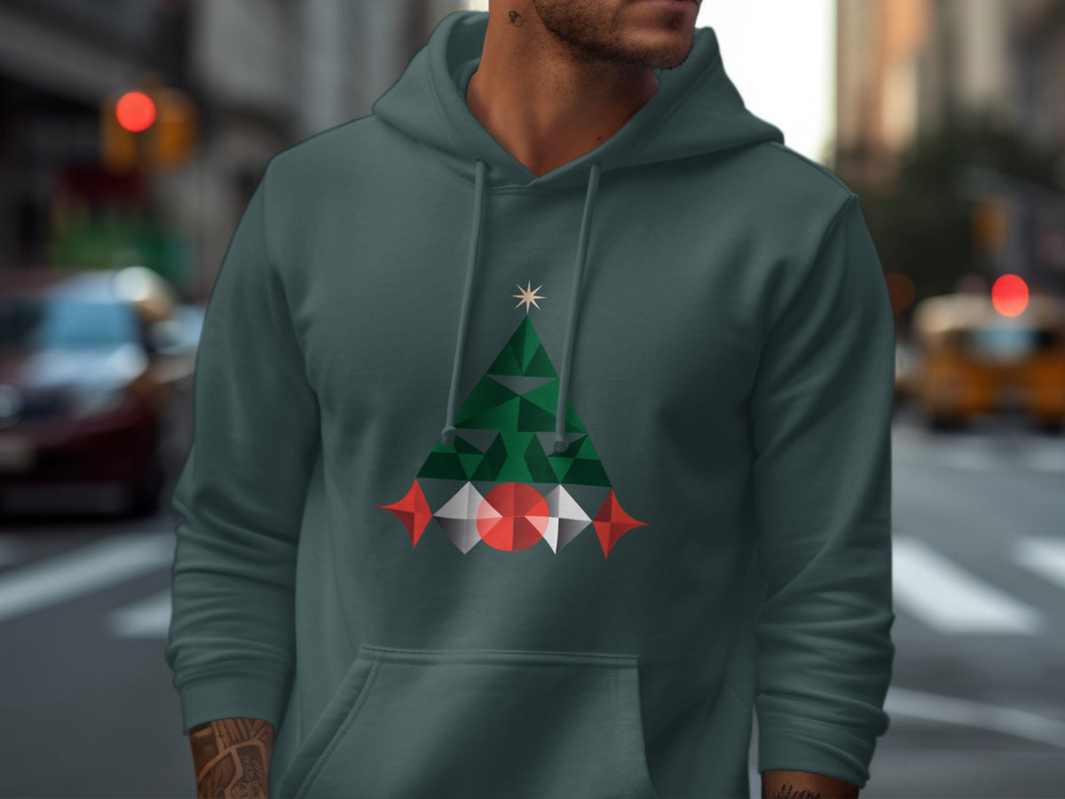 Dark teal hoodie featuring a geometric Christmas tree graphic with star and red/white ornaments.