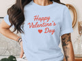 Light blue t-shirt with red "Happy Valentine's Day" text and heart.