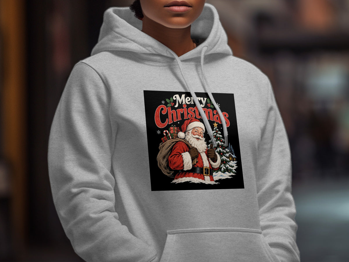 A person wearing a light gray hooded sweatshirt with a vintage-style Santa Claus graphic that reads Merry Christmas.