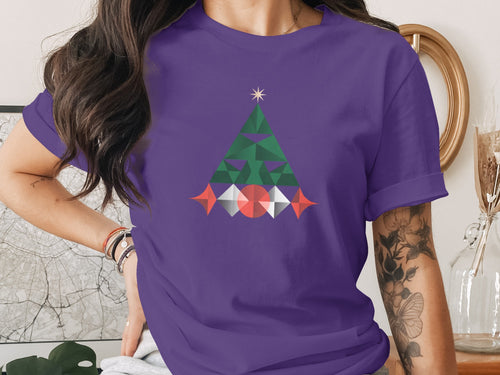 Purple t-shirt with a geometric Christmas tree graphic and a star.