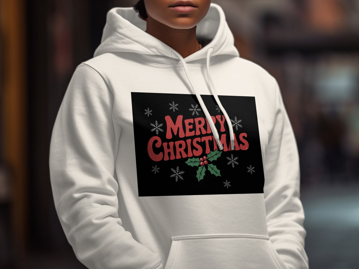 A person wearing a white hooded sweatshirt with a black rectangular graphic featuring red Merry Christmas text and snowflakes.