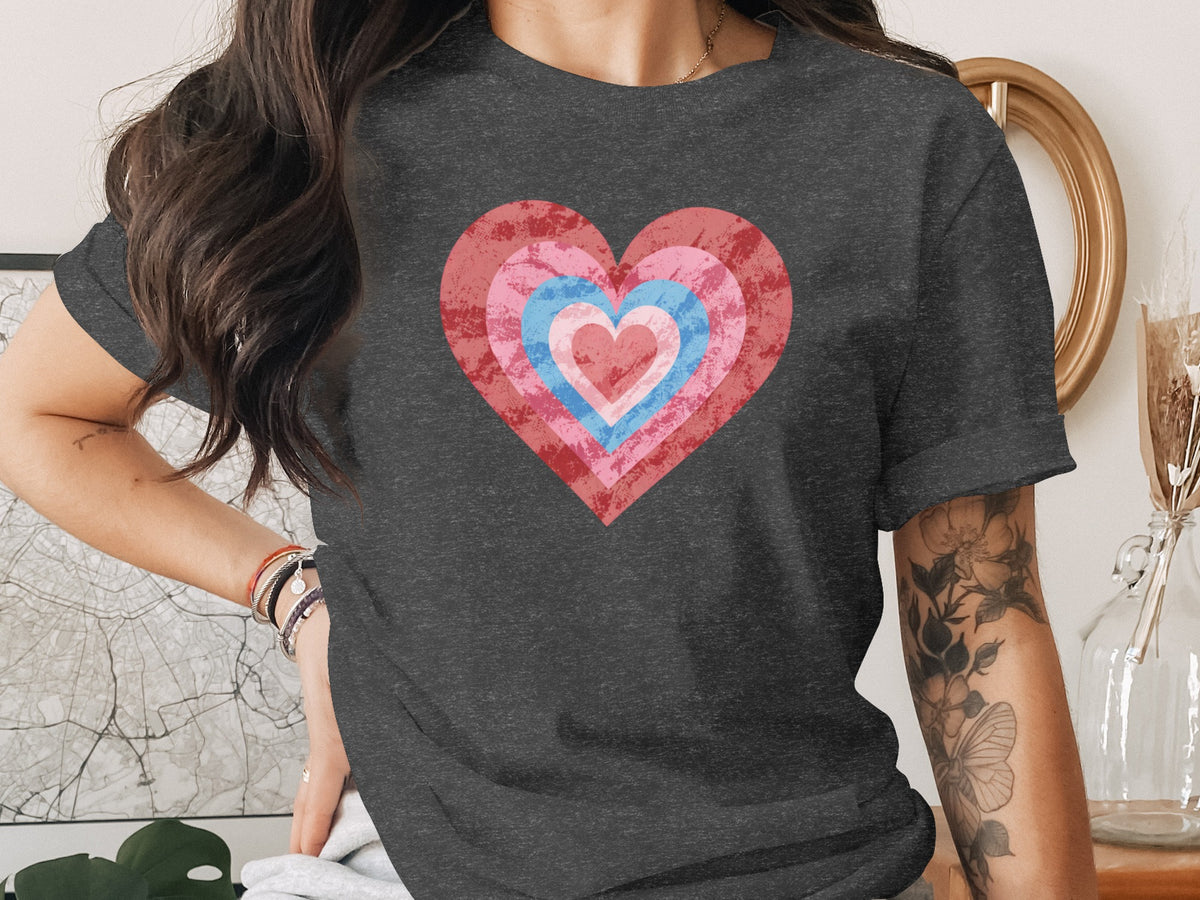 Dark gray t-shirt with concentric hearts in red, pink, and blue hues.