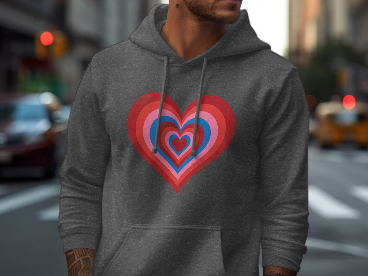 Dark grey hoodie with a layered heart graphic in pink and blue tones.