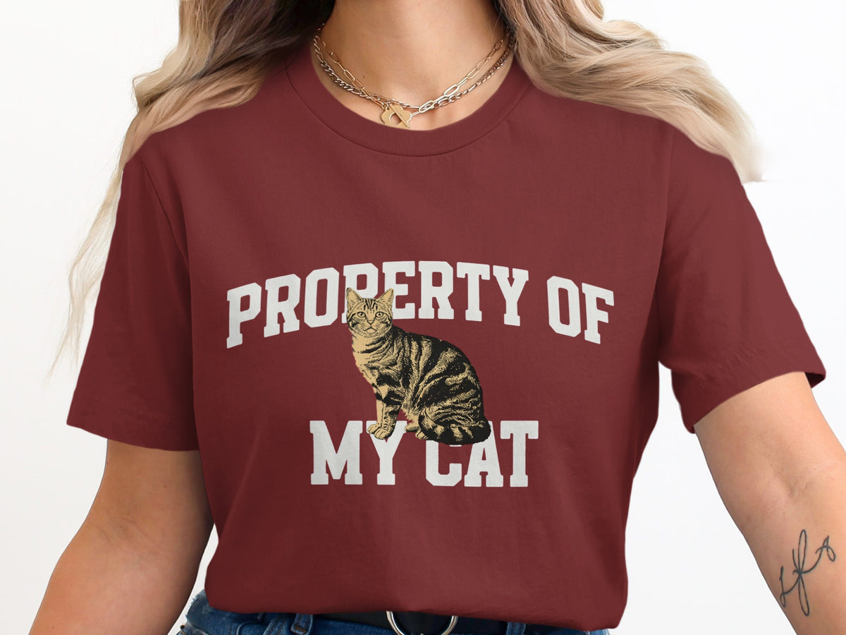 Maroon t-shirt with "PROPERTY OF MY CAT" and a tabby cat graphic.