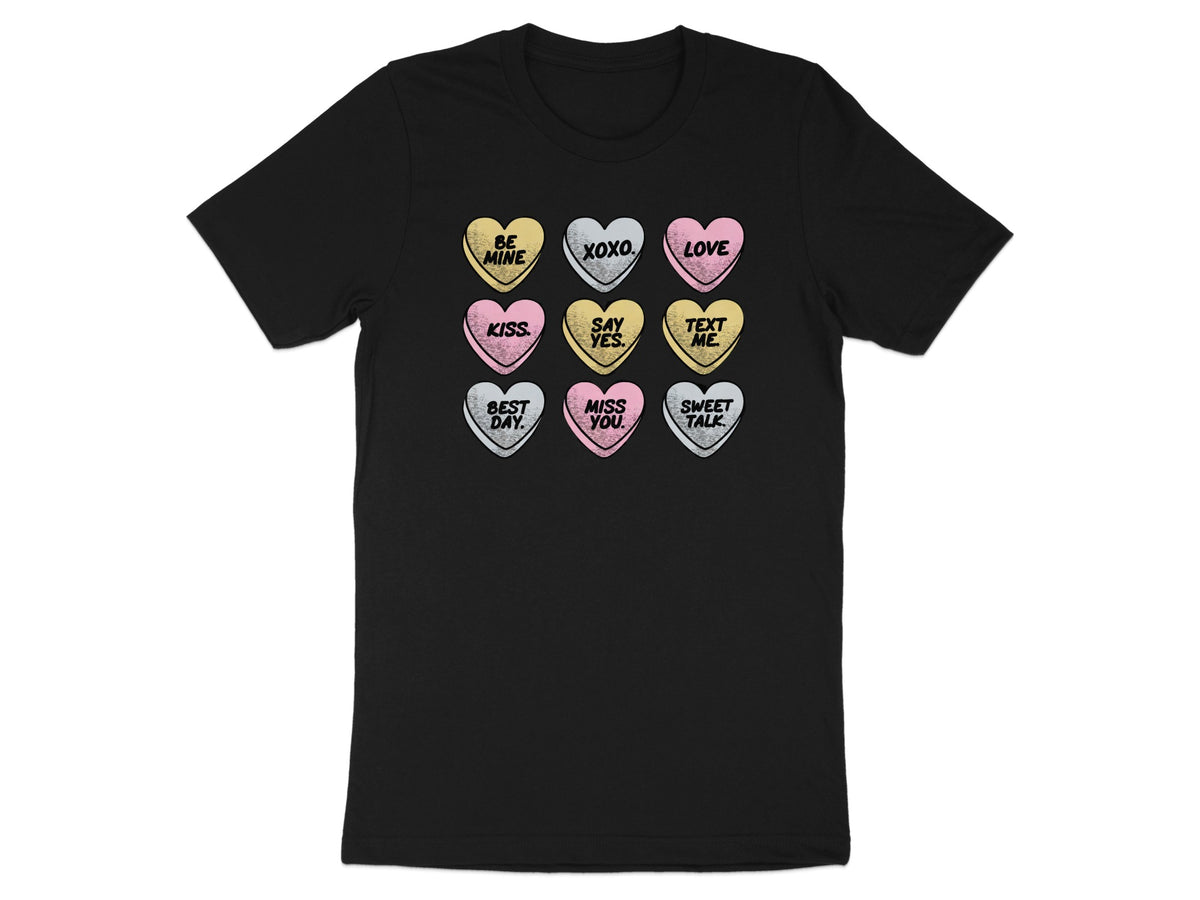 Black t-shirt featuring a grid of nine pastel conversation hearts printed on the chest.