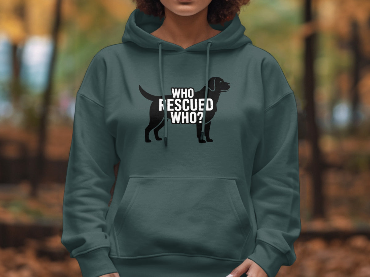 Dark teal hoodie with a black dog silhouette and white text "WHO RESCUED WHO?".
