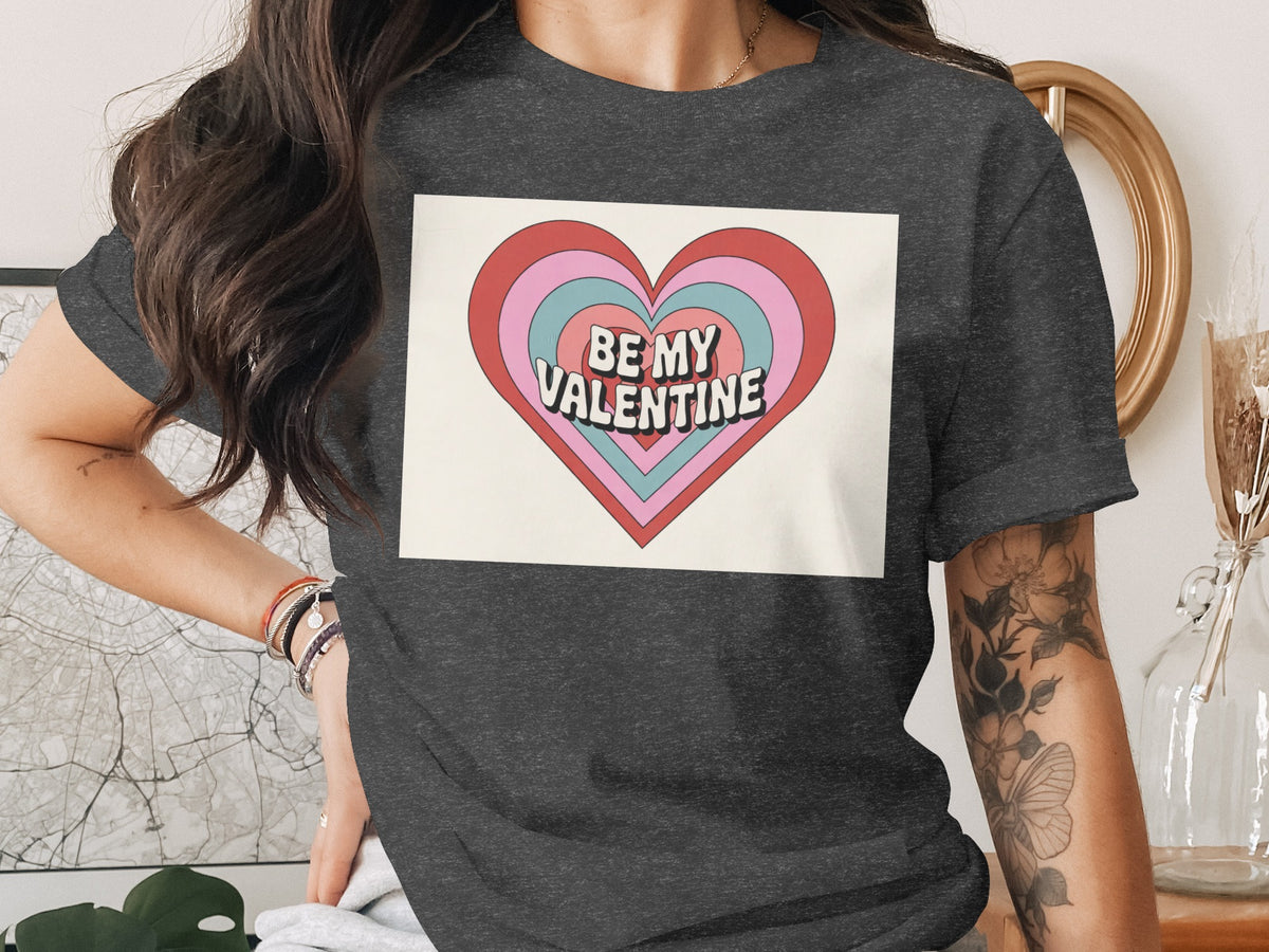 Dark grey t-shirt with "Be My Valentine" text in a retro heart design.