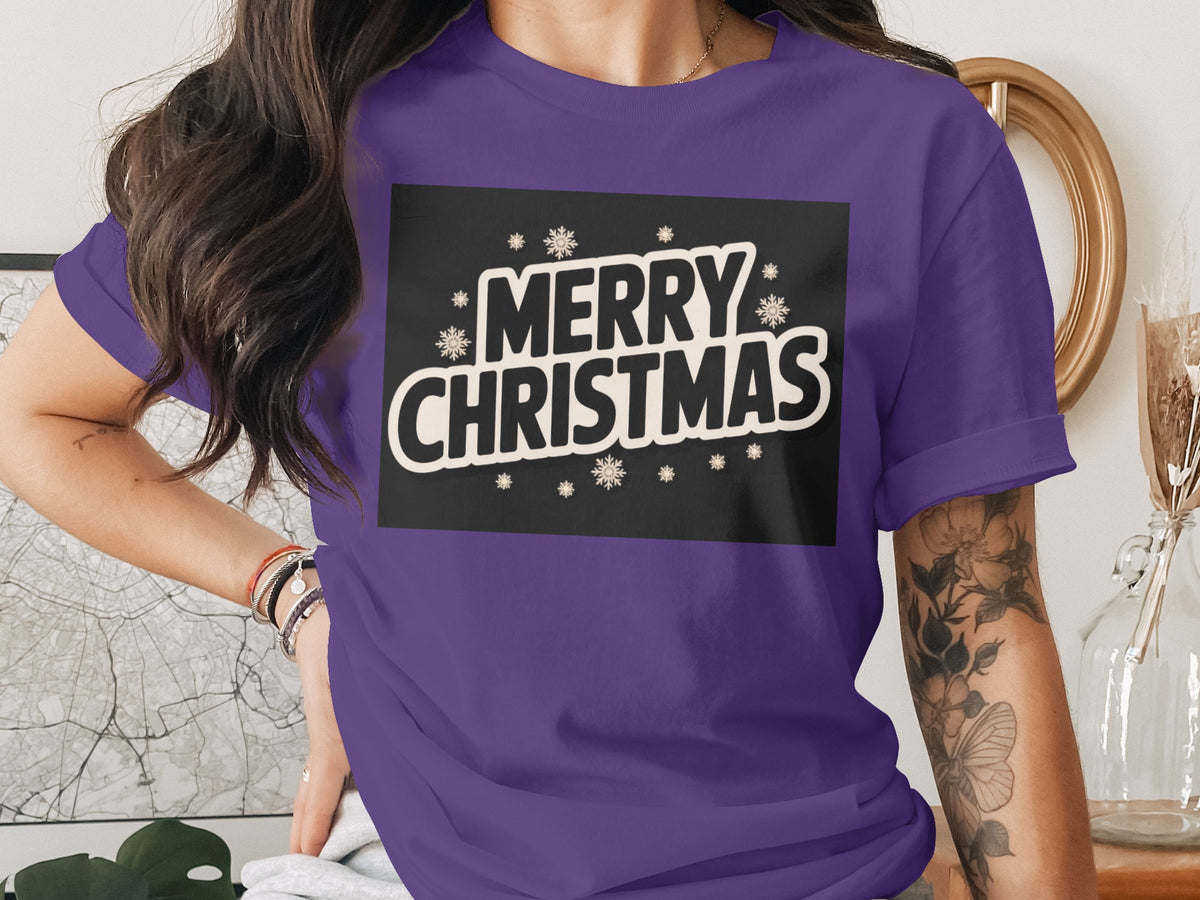 Purple t-shirt with "Merry Christmas" text and snowflakes design.