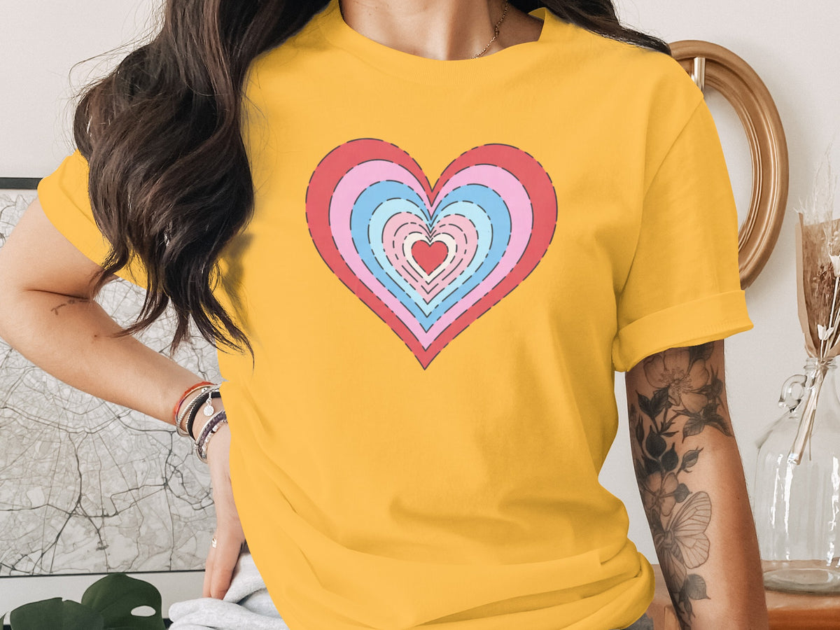 Yellow t-shirt with a concentric heart graphic in red, pink, and blue.
