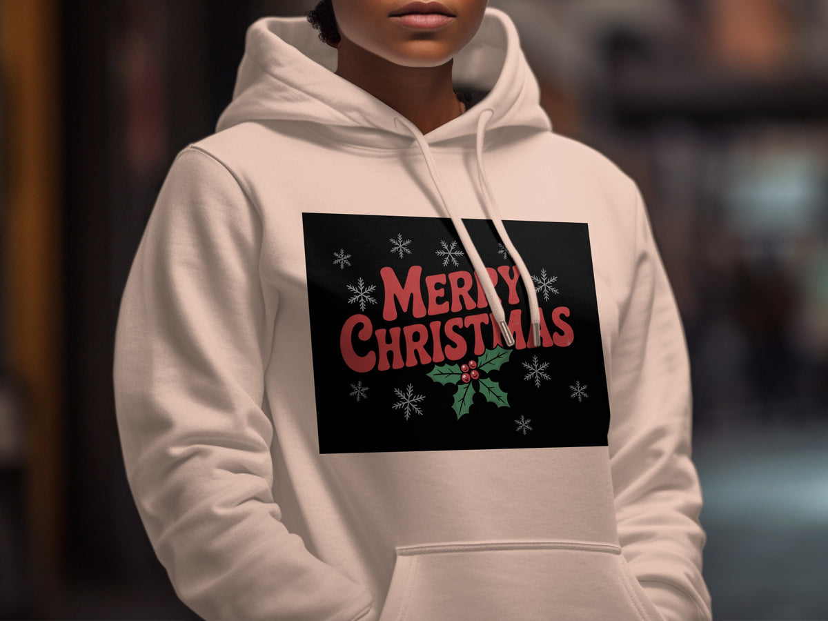 A person wearing a white hoodie featuring a black rectangular graphic with red "Merry Christmas" text and snowflake illustrations.
