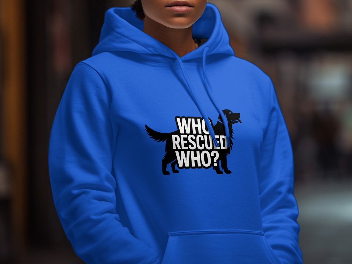 A person wearing a bright blue hooded sweatshirt featuring a black dog silhouette and the white text Who Rescued Who.